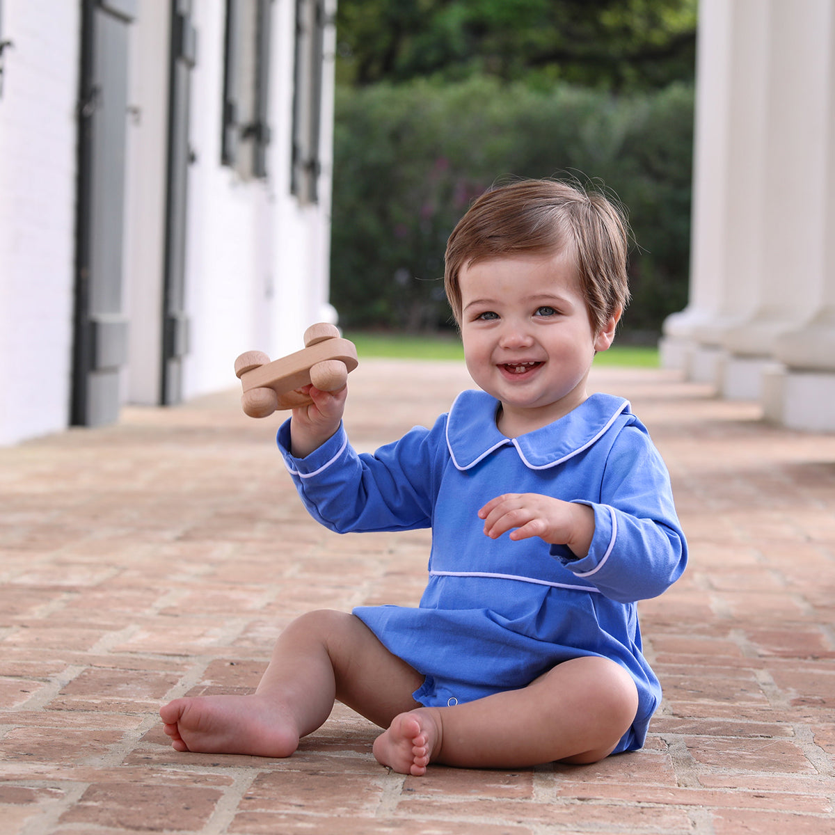 Baby boy in a blue bubble with long sleeves