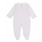 A white long-sleeve baby girl zip-up footed sleeper with a delicate light pink bow and heart pattern and Kissy Kissy brand label.
