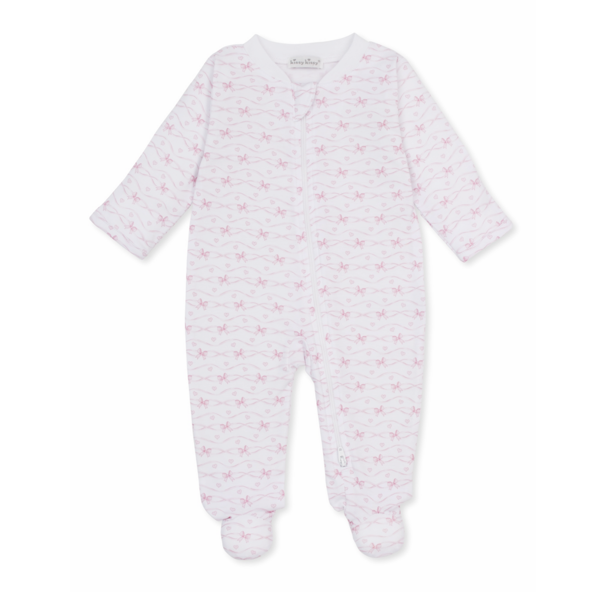 A white long-sleeve baby girl zip-up footed sleeper with a delicate light pink bow and heart pattern and Kissy Kissy brand label.