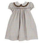 A toddler girl's dress with a beige, tan, blue and brown plaid pattern featuring a ruffled Peter Pan collar and short puff sleeves.