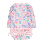 Back view of a girls long sleeve rashguard swimsuit with a pink bows and flowers design with bows at the hips, zip closure, and ruffles across the bottom.
