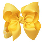 Large yellow grosgrain classic hair bow with double knot center.