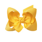 Bright yellow grosgrain classic hair bow with double knot center.