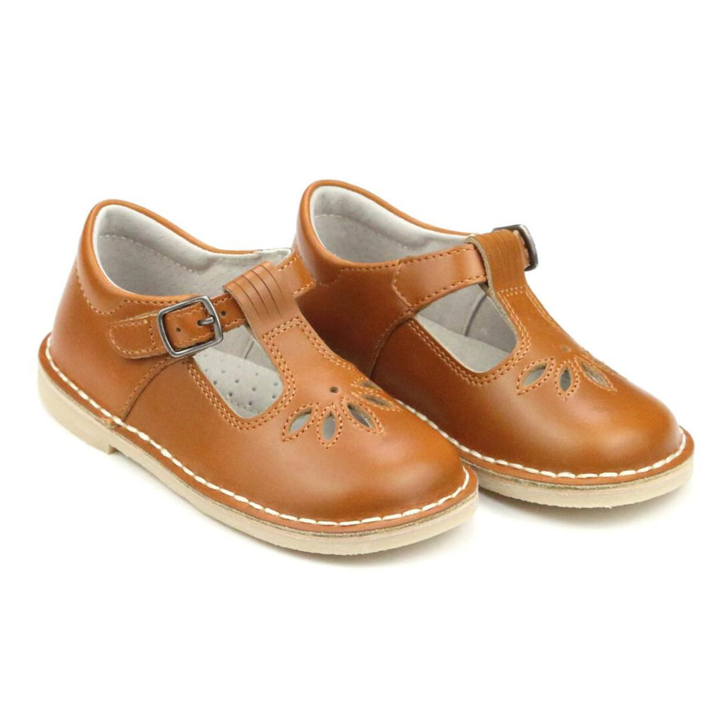 Pair of brown little girl’s T-strap Mary Jane shoes with buckles