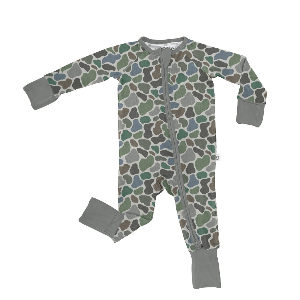 Baby onesie with camouflage pattern and gray accents on a white background