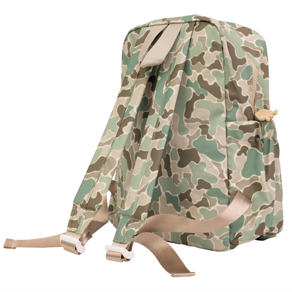 Shoulder strap view of a camouflage patterned laminated backpack.