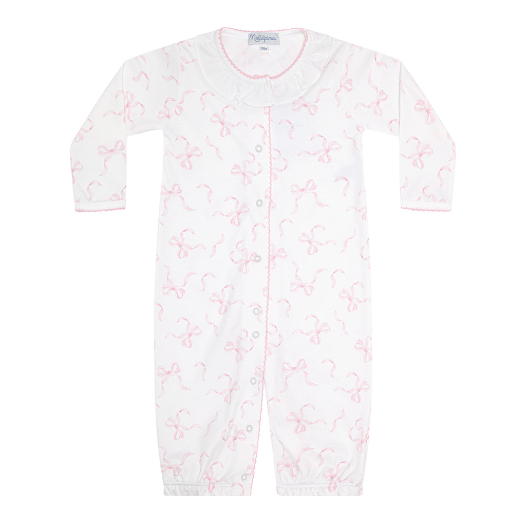 Baby girl's converter gown romper with a white ruffled collar and pink bows print.