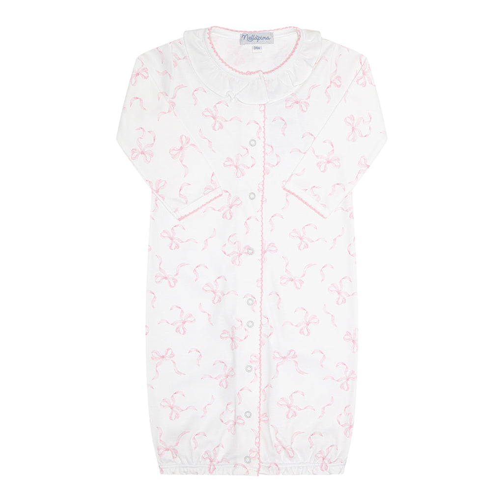 Baby girl's converter gown with a white ruffled collar and pink bows print.
