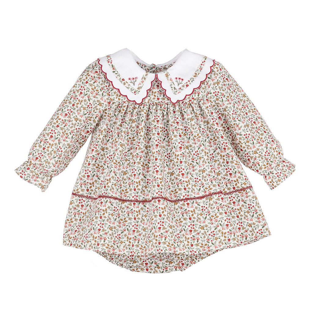 A baby girl's classic long-sleeve bloomer set in a dense mulberry, green, and creamy white floral and berries print with a matching diaper cover and elegant scalloped collar featuring an embroidered design. 