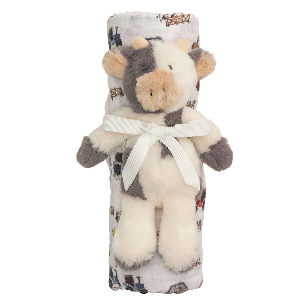 Plush cow baby rattle toy with a farm print muslin swaddle blanket gift set tied with a ribbon