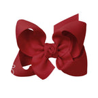 Cranberry red grosgrain classic hair bow with double knot center.