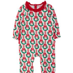 A baby long-sleeve footless one-piece jumpsuit featuring a festive Christmas wreath and candy cane pattern on a white background, with a contrasting red collar and red side ties.