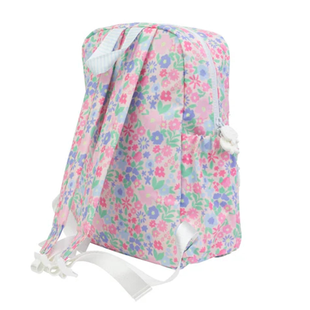 Back view of a pink, blue and lavender floral ditsy pattern backpack.
