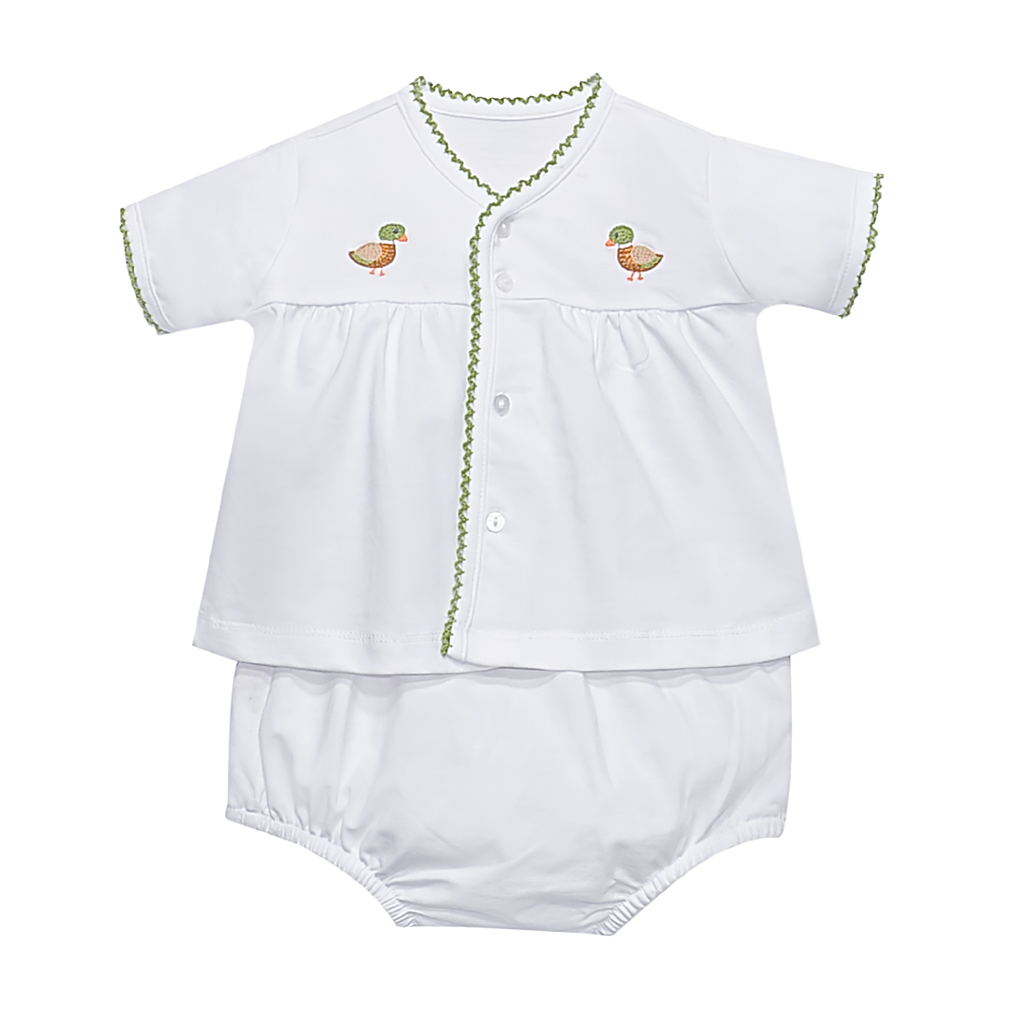 A white baby two-piece diaper set consisting of a short-sleeve button-front top with green trim and embroidered duck motifs, paired with matching white bloomers.