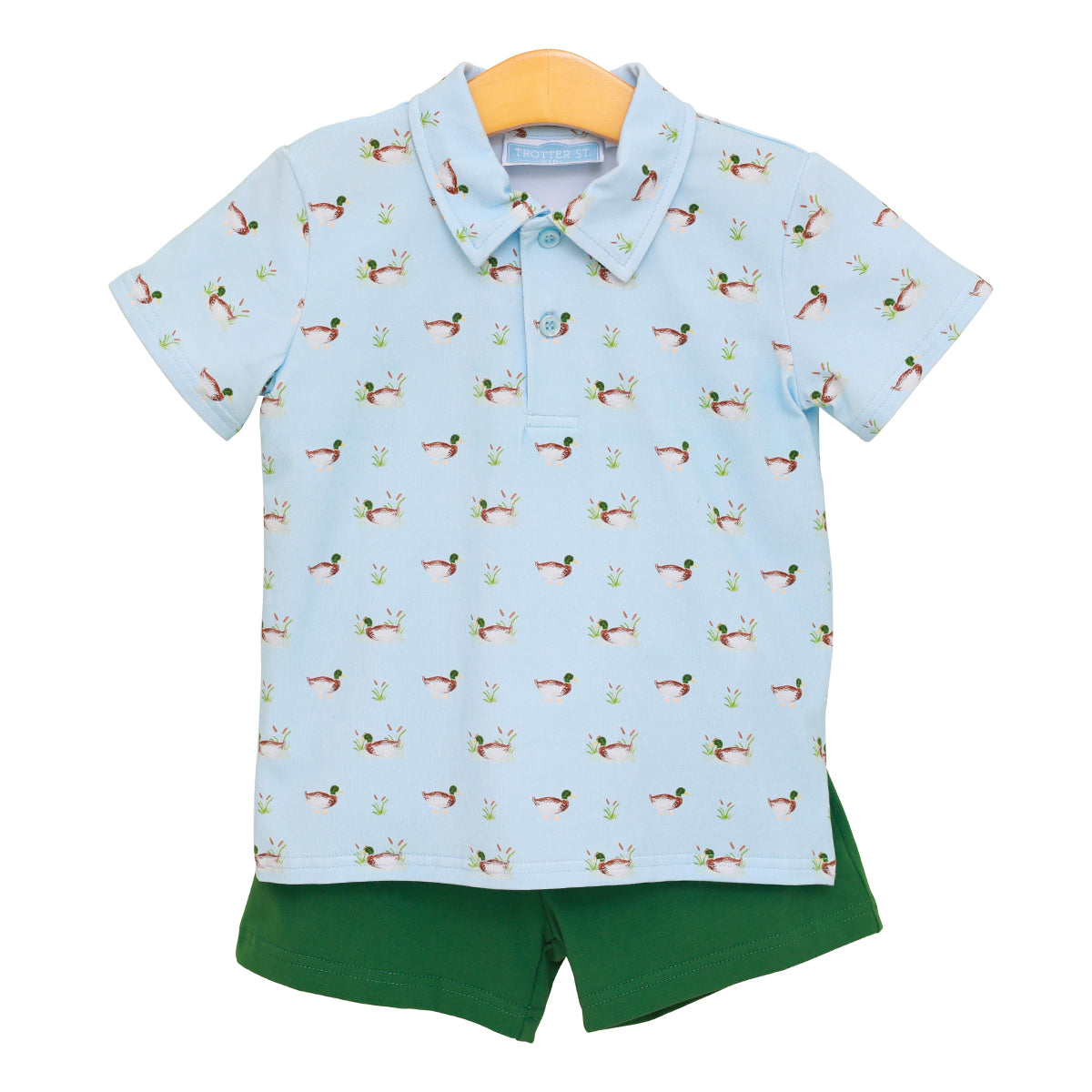 Boy's outfit with a light blue polo shirt featuring duck pattern and dark green shorts.