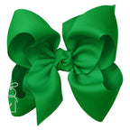 Large green grosgrain classic hair bow with double knot center.