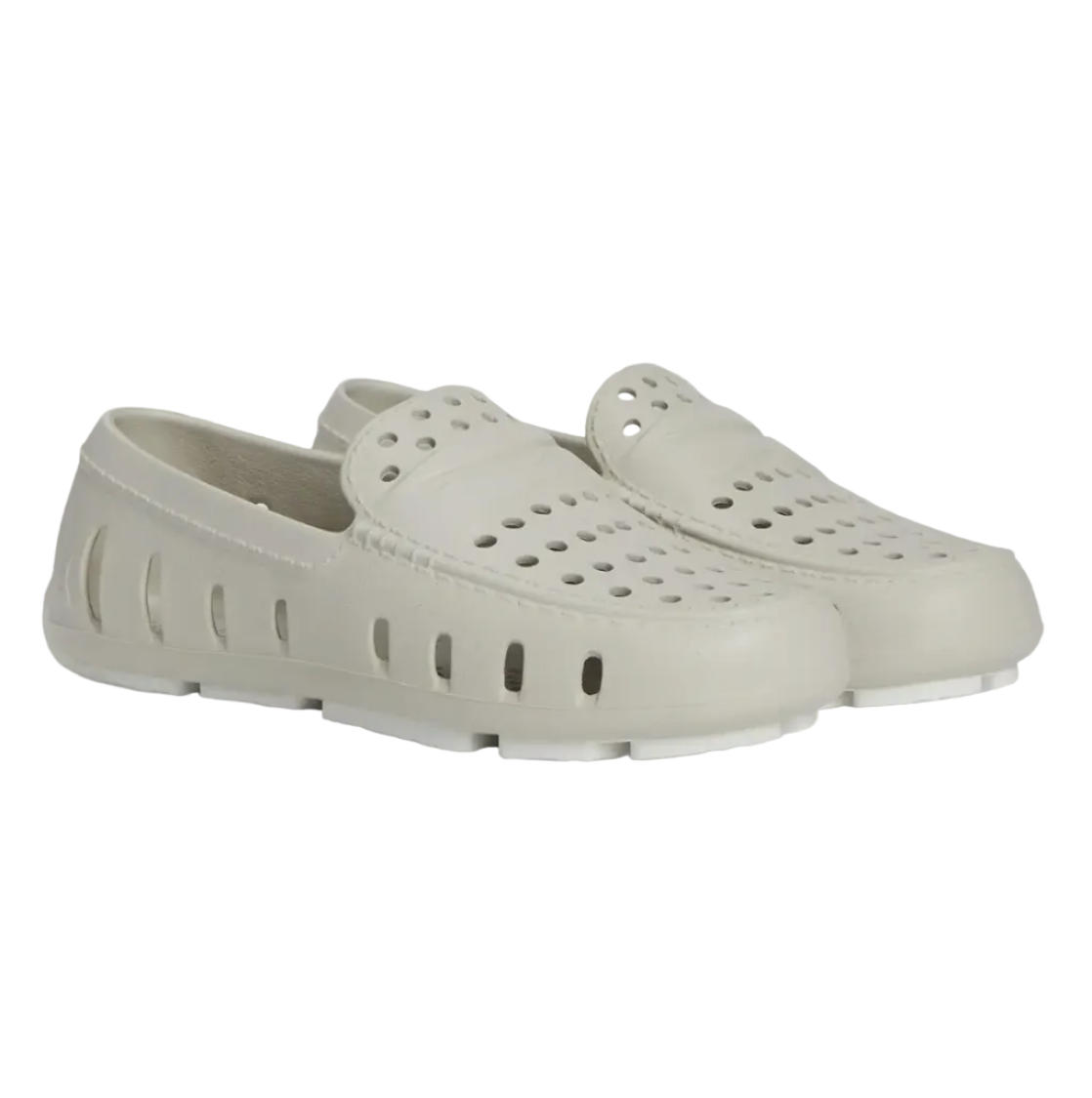 A pair of beige toddler Floafers shoes with bright white soles. 