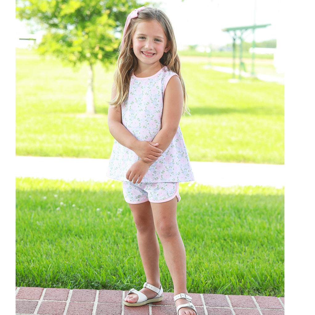 Little girl wearing a floral knit sleeveless top and shorts set with pink trim