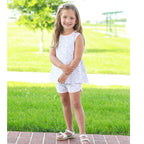 Little girl wearing a floral knit sleeveless top and shorts set with pink trim