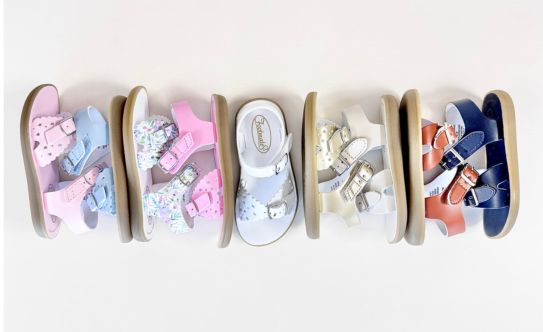 Row of colorful children's Footmates sandals 