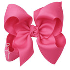 Large fuchsia pink grosgrain classic hair bow with double knot center.