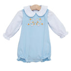 A baby girl's light blue long-sleeve bubble paired with a white long sleeve knit shirt and appliqued embroidered bow with pumpkins.