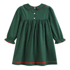 A dark green long-sleeve baby dress with a Peter Pan collar, three white buttons, and red wavy trim details along the collar, cuffs, and hem.