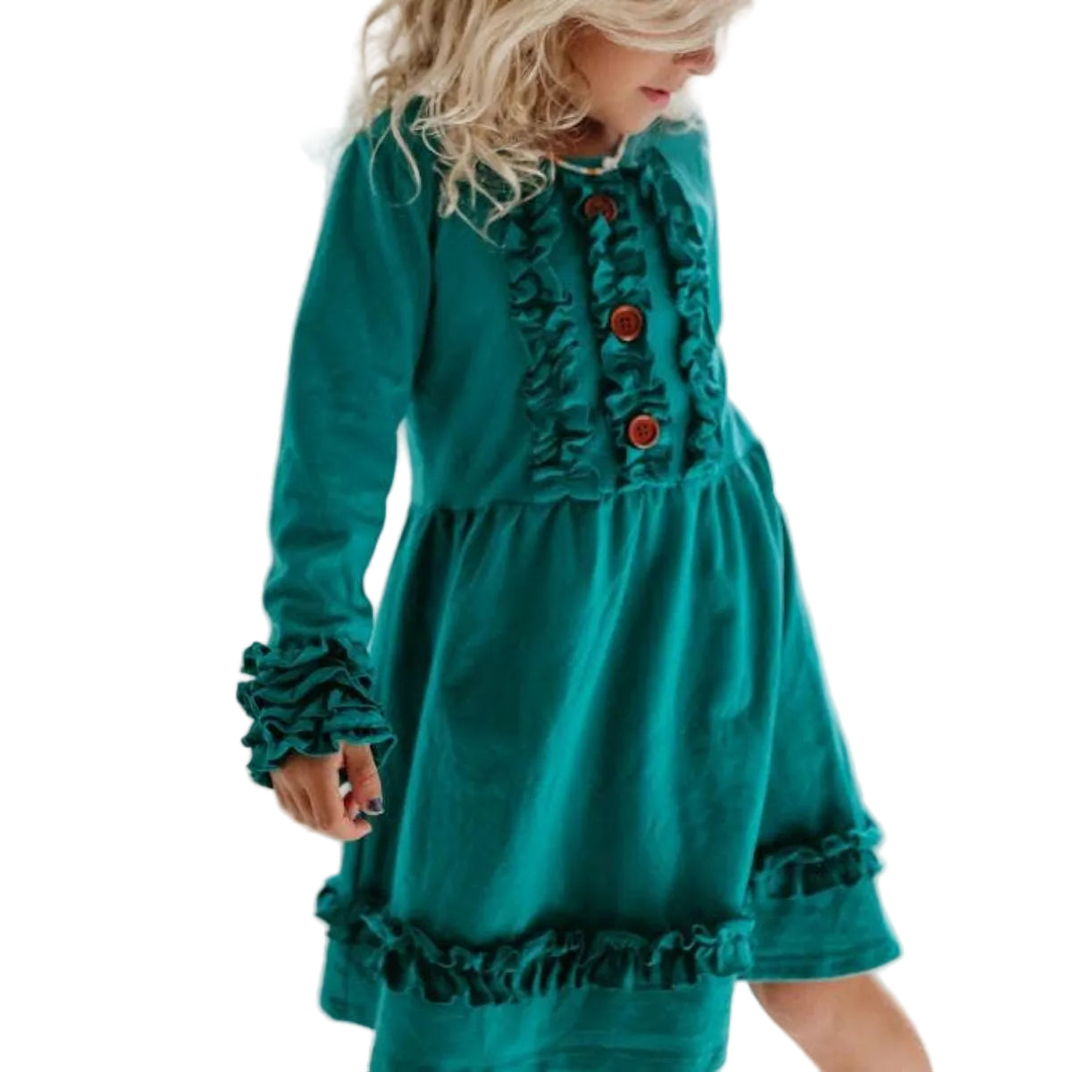 Child wearing a teal dress with ruffles in a bright room.