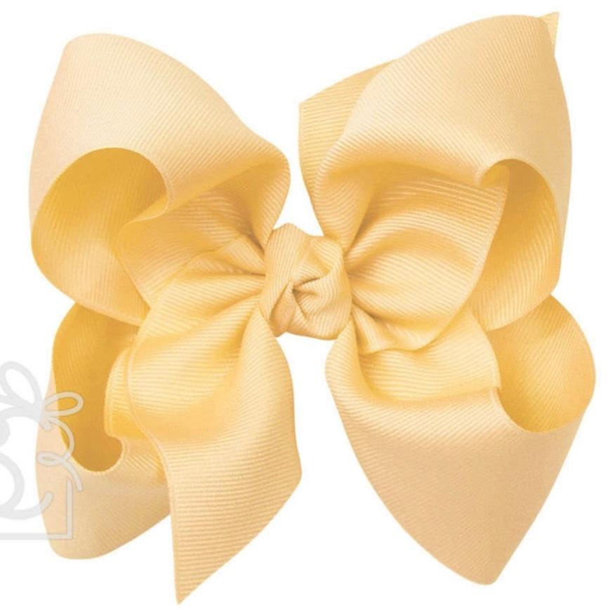 Large light yellow grosgrain classic hair bow with double knot center.