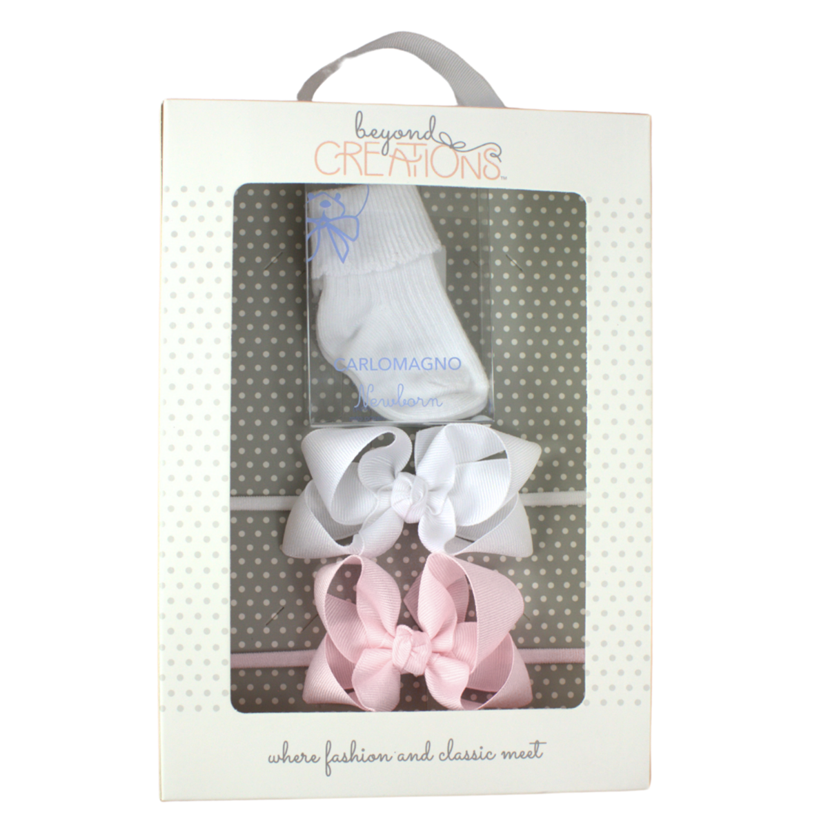 Boxed baby gift set of white baby socks, a light pink bow headband, and a white baby bow headband. 