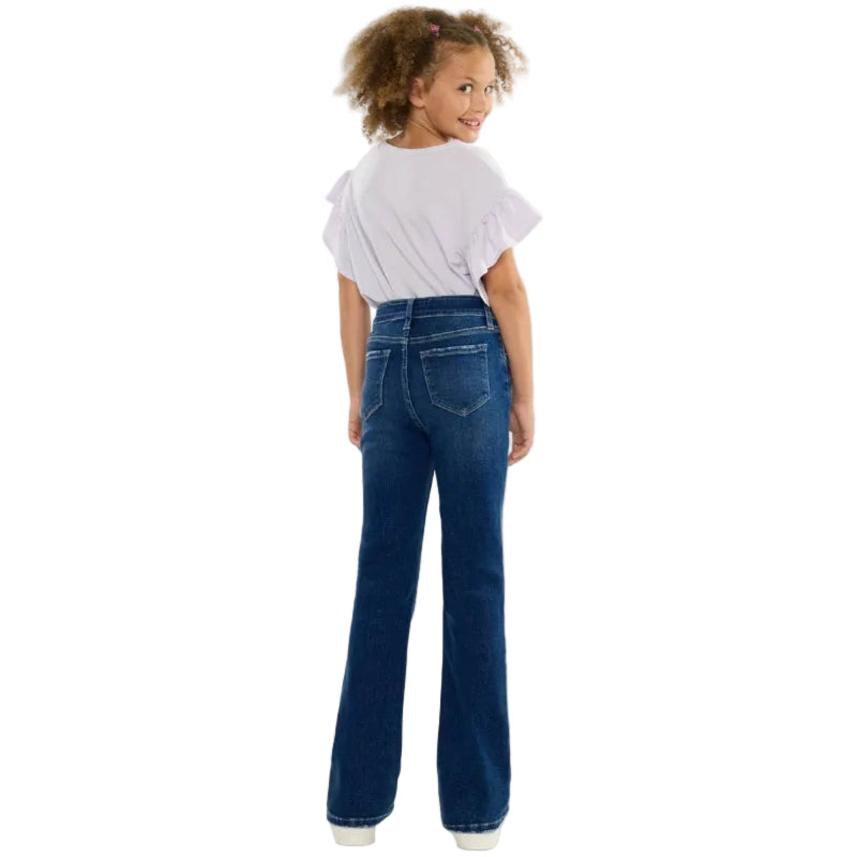 Child wearing blue jeans and a white shirt on a white background