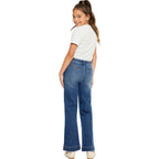 Person wearing blue jeans and a white shirt on a white background