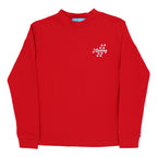 A red long-sleeve crewneck t-shirt with a J. Bailey and dawg footprint design.