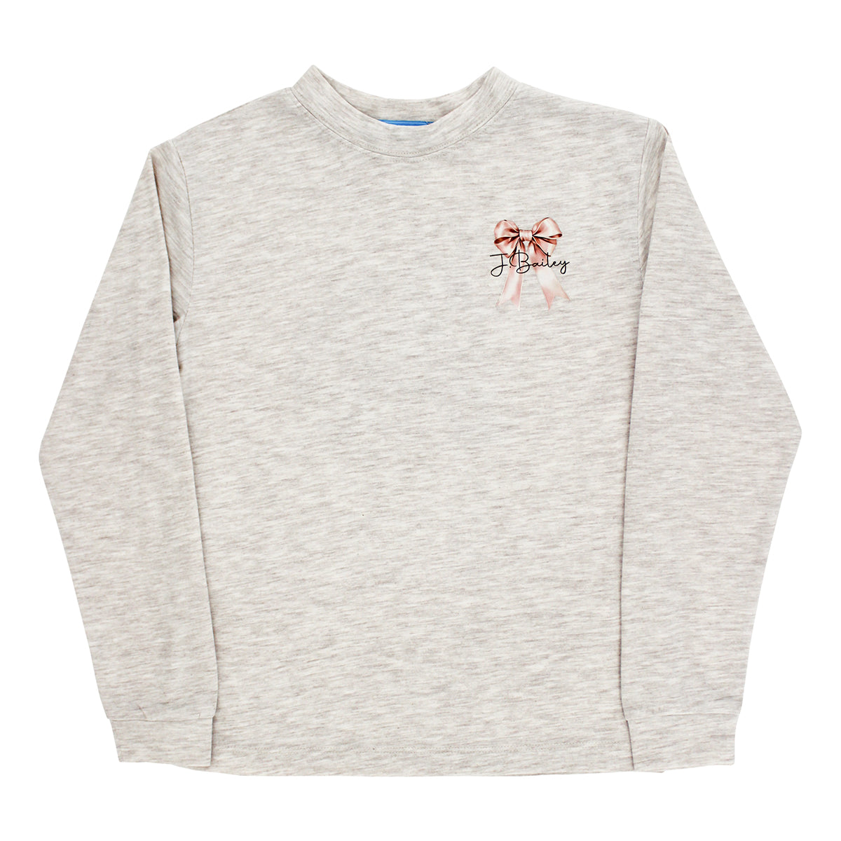 A girl's light heather beige long-sleeve crewneck sweatshirt with a pink bow and a J. Bailey logo on the front.