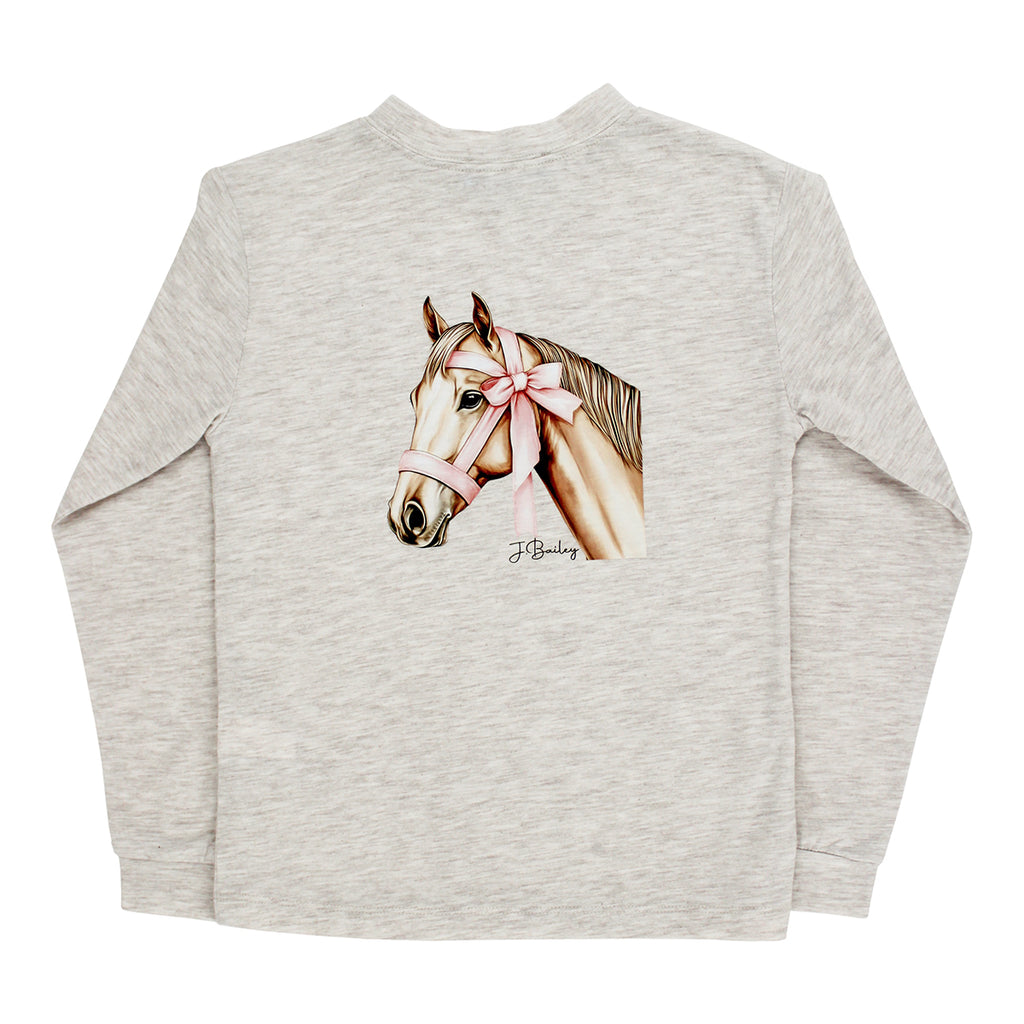A girl's light heather beige long-sleeve t-shirt with a detailed graphic of a horse wearing a pink bow on its halter.