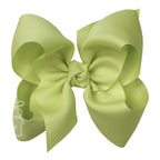 Large light green grosgrain classic hair bow with double knot center.