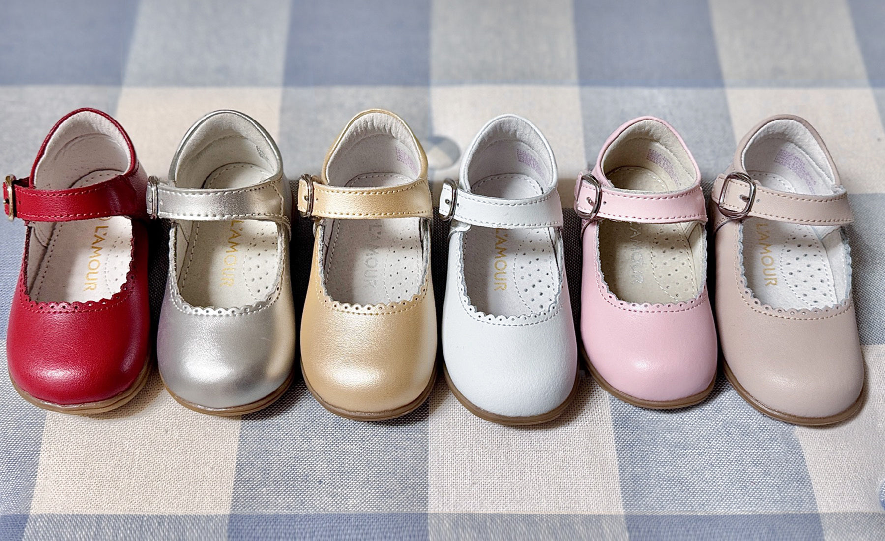 Row of different color L'Amour Chloe Mary Janes.