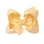 Light yellow grosgrain classic hair bow with double knot center.