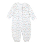 Baby girl’s Pima cotton converter gown with white ruffle neckline and pink and blue floral Liberty-inspired print on white background.