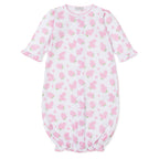 Baby gown with pink hydrangea floral pattern and Kissy Kissy brand label