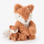 Two plush fox toys, one mama fox and one baby fox