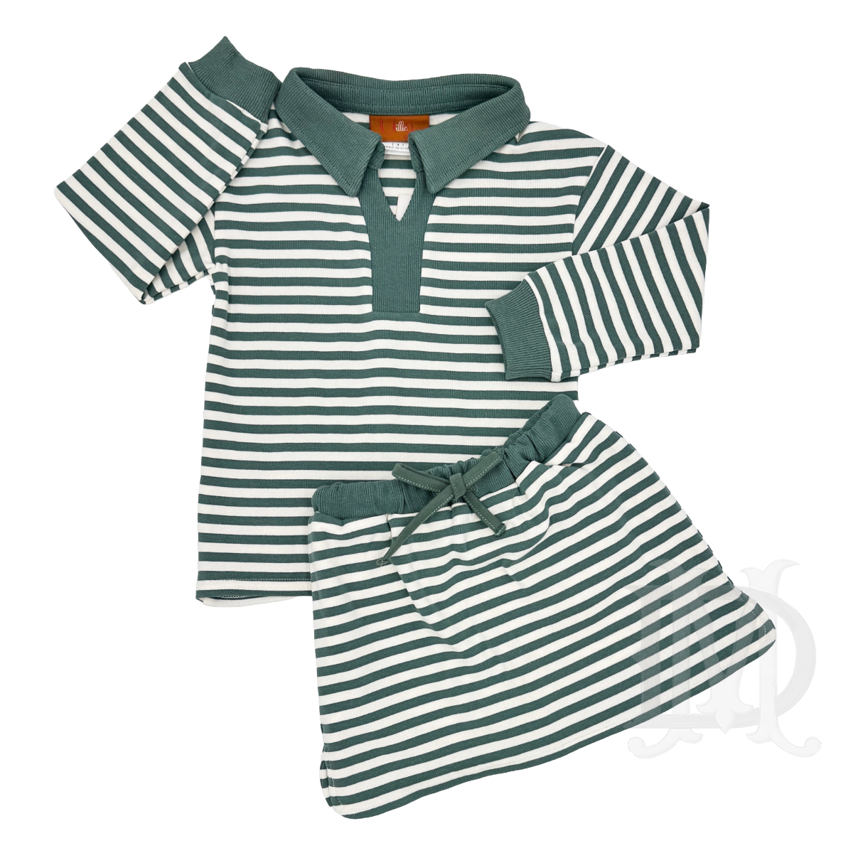 A two-piece girl's outfit featuring a long-sleeve green and white striped top and matching skort and solid green trim on the collar, sleeve cuffs, and a matching drawstring tie.