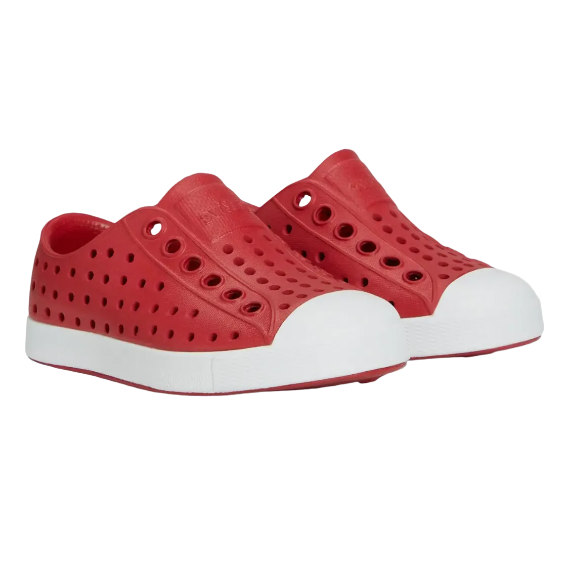A pair of red toddler Native shoes with white soles. 