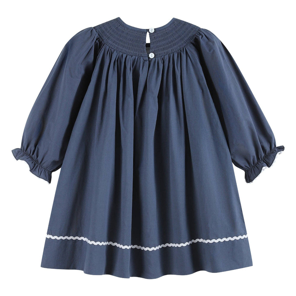 Blue dress with white trim on a white background