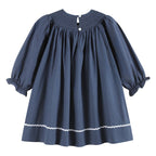 Blue dress with white trim on a white background