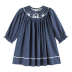 Navy blue dress with white embroidery on a white background