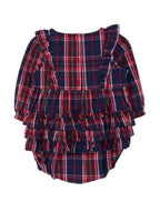 A toddler girl's long-sleeve ruffled romper in a navy blue, red, and green tartan plaid pattern, shown against a plain light gray background.