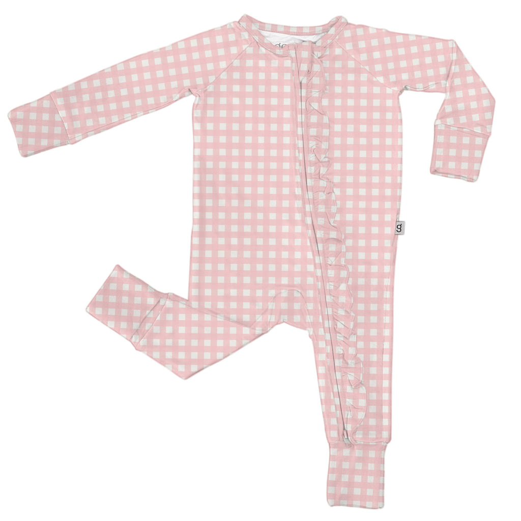 Pink checkered baby onesie on a white background