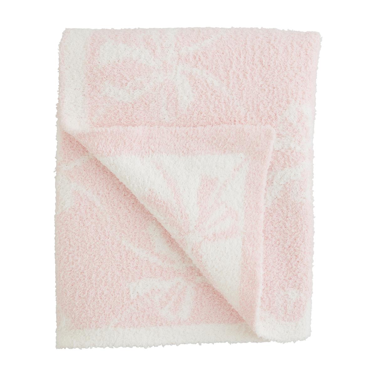 Pink and white chenille blanket with bow design.