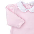 Light pink jacquard Pima cotton baby girl’s romper with white collar featuring delicate pink embroidery.